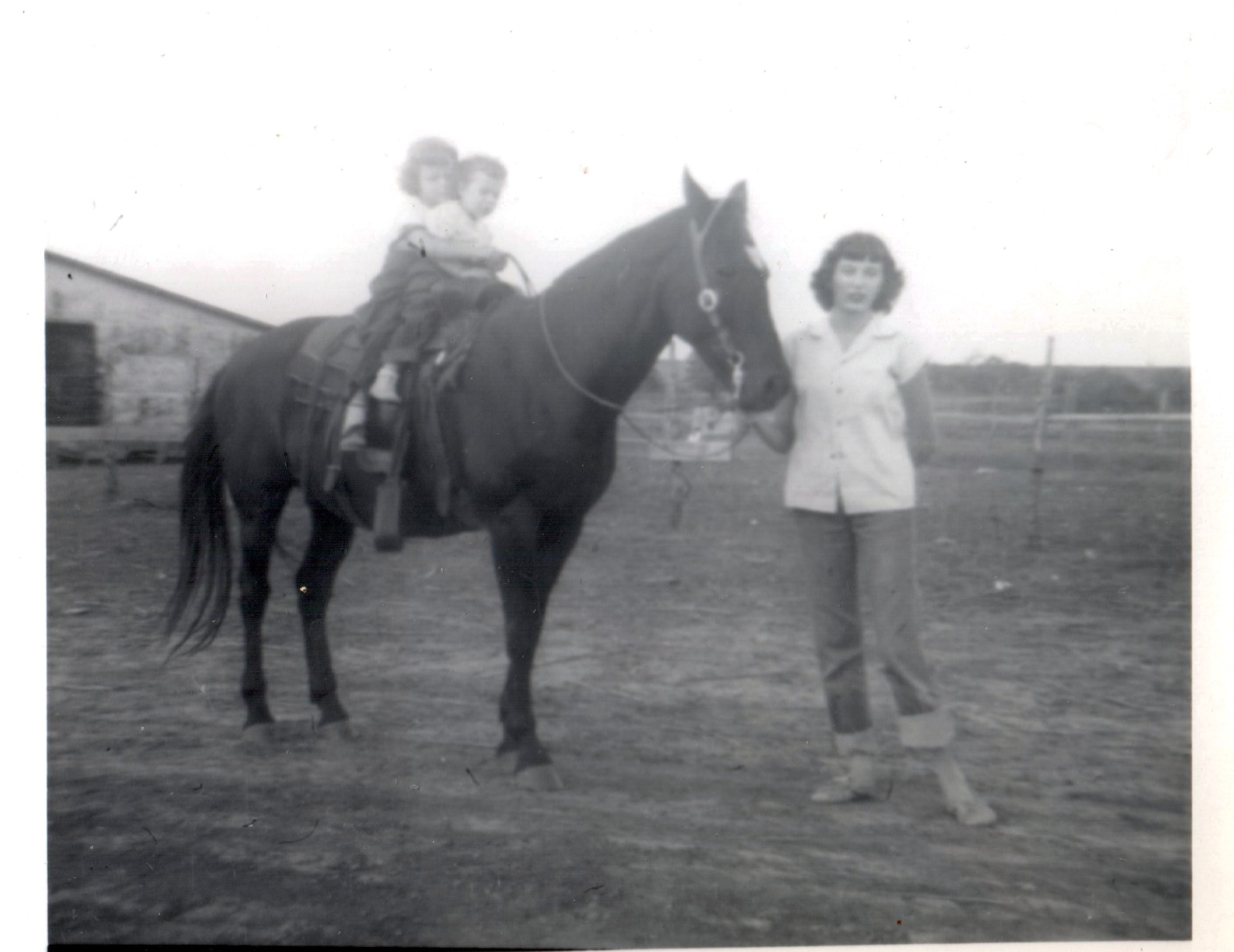 Arlene (about 5) and Elice (age 2½), 1950 — visiting cousin Rita in Texas, riding Bess