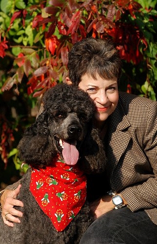 Elice with poodle wearing a heart bib