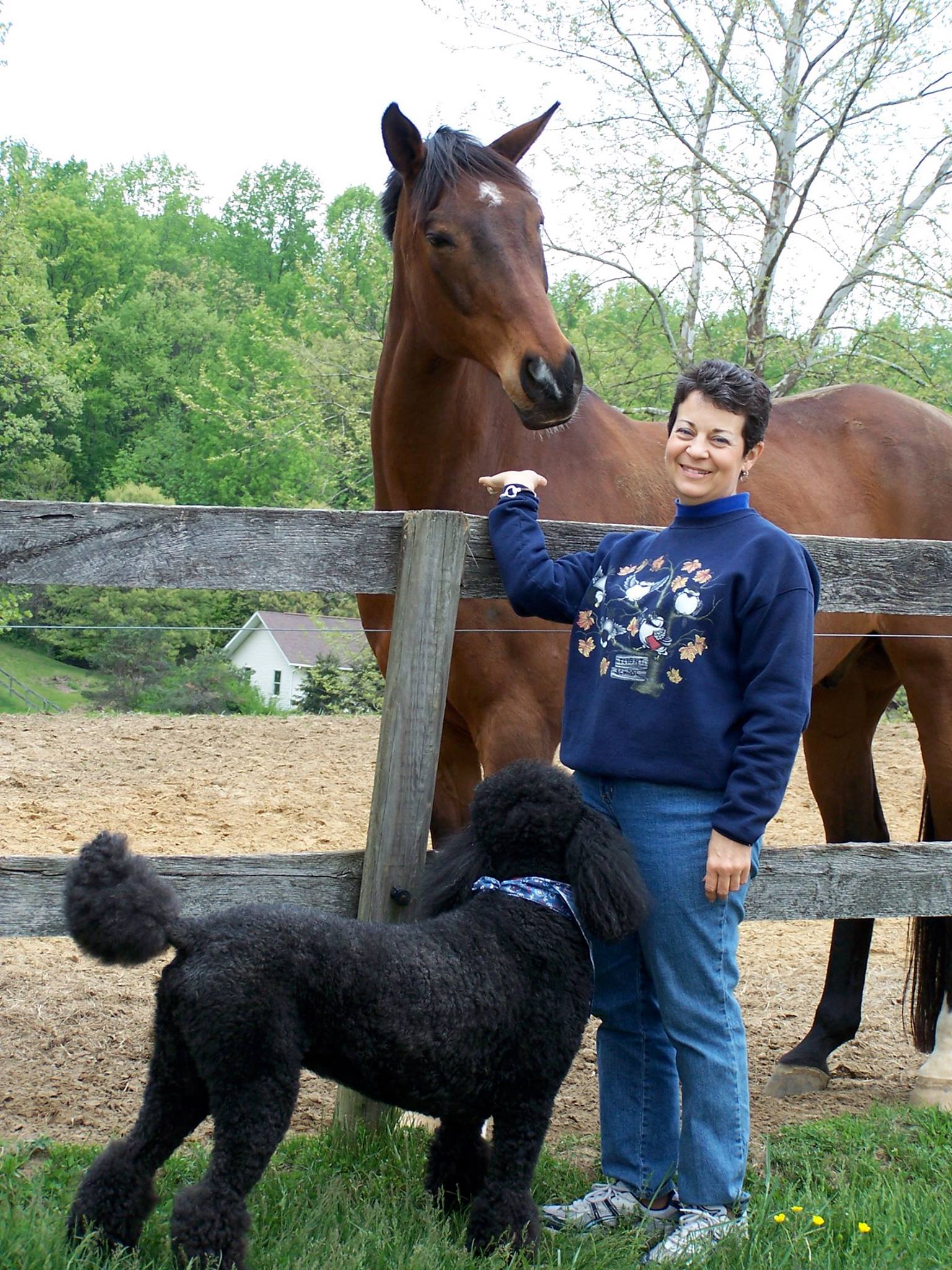 Elice with her horse and poodle