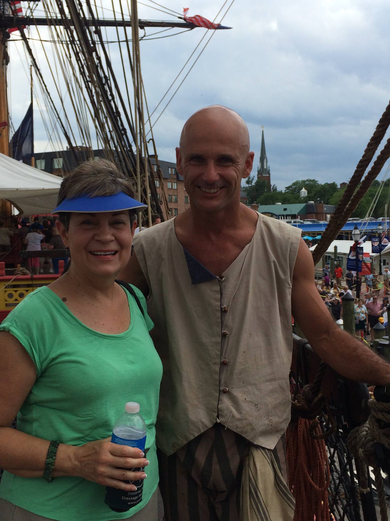 Elice with a tall ship actor at Annapolis harbor